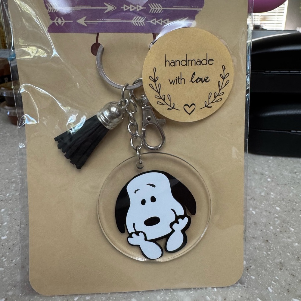 Snoopy keychain with black tassel